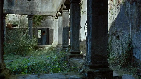 Exploring an abandoned building in a forgotten location at twilight Stock Footage 327964883