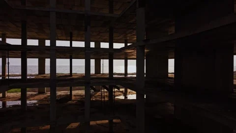 Exploring an abandoned building at sunset near the coast Stock Footage 324520646
