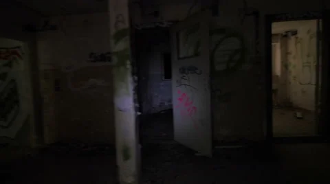 Exploring an abandoned building with torch light 스톡 동영상 58291366