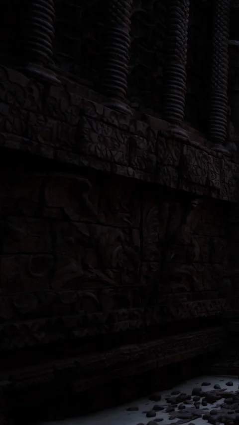 Exploring ancient carvings on a temple wall at night in India Stock Footage 340873727