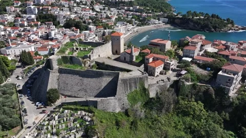 Exploring the ancient fortress overlooking the charming coastal town of Saranda Stock Footage 287800248
