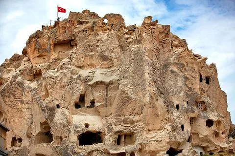 Exploring the ancient rock formations and cave dwellings in Cappadocia at dus Stock Photos
