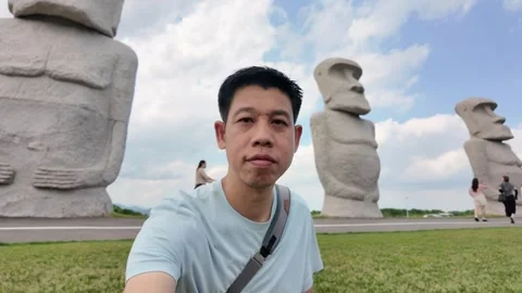 Exploring Ancient Statues in a Scenic Landscape Stock Footage 313835104