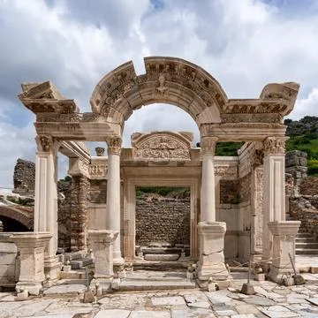 Exploring the ancient Temple of Hadrian in Ephesus, Turkey under a cloudy sky Stock Photos