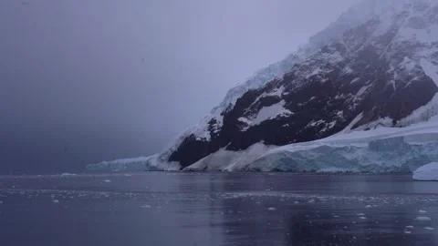 Exploring the Antarctic Coastline with Snow-Capped Mountains, Icebergs 스톡 동영상 339610974