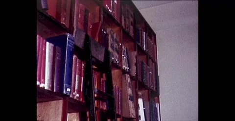 Exploring an Antique Library: Deteriorating Books on Shelves - 1980s Stock Footage 261142635