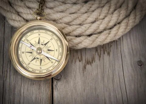 Exploring background with compass and rope Stock Photos