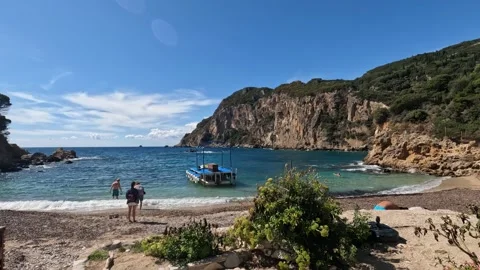 Exploring the beautiful coastline of Corfu, Greece on a sunny day by the beach Video stock 285596360