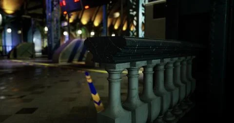 Exploring a beautifully lit corridor with intricate details at night 库存插图