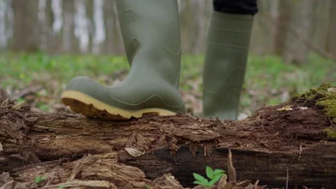 Exploring the Beauty of Nature while Wearing Colorful Green Rubber Boots on Stock Footage 305267123