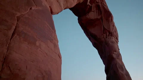 Exploring the beauty of red rock arch at sunset in mountain desert Stock Footage 321601807