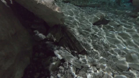 Exploring bottom of cenote Sun Beams Liven Up A Cenote Mexico Yucatan Stock Footage 253194532