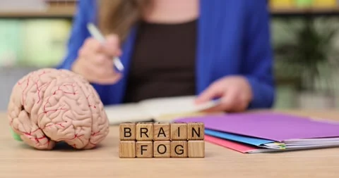 Exploring brain fog through creative learning and engagement in a cozy workspace Stock Footage 320945500