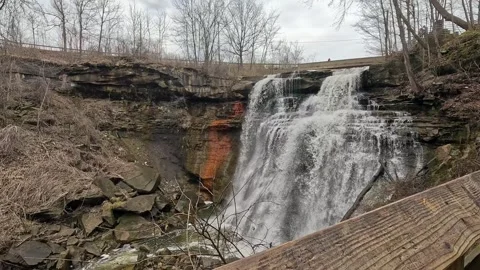 Exploring Brandywine Falls in Cuyahoga Valley during a tranquil afternoon Stock Footage 312573113