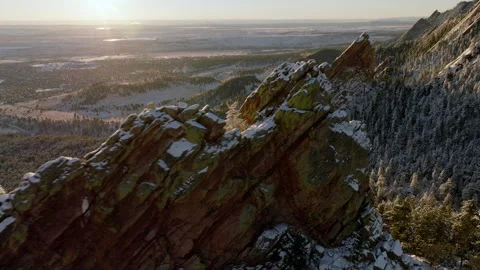 Exploring breathtaking mountain rocks in a serene forest town at sunset Stock Footage 288900340