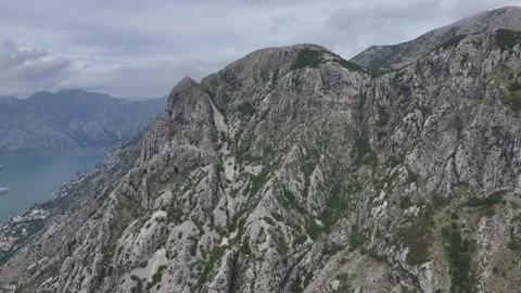 Exploring the breathtaking mountain views above Kotor with a glimpse of the Stock Footage 287756122