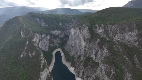 Exploring the breathtaking views of Piva Lake surrounded by majestic mountains Video stock 287788227