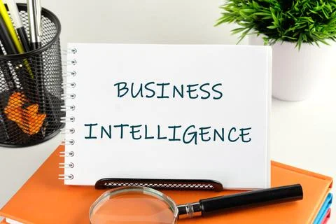 Exploring business intelligence concepts with notes and tools on a desk Stock Photos