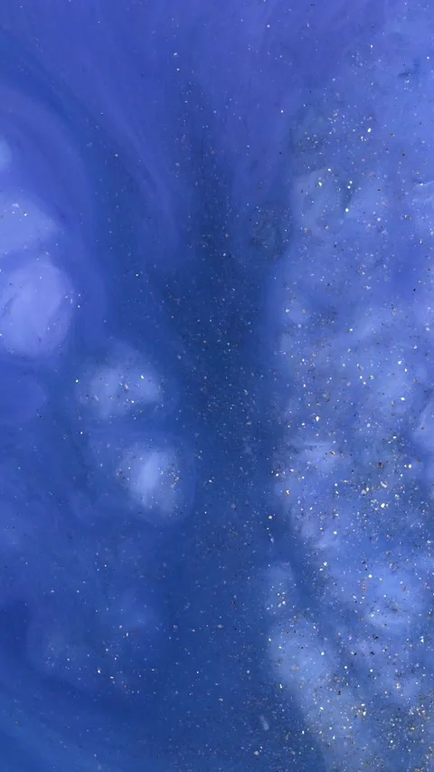 Exploring the captivating process of creating alcohol ink abstract art on a blue Stock Footage 292932370