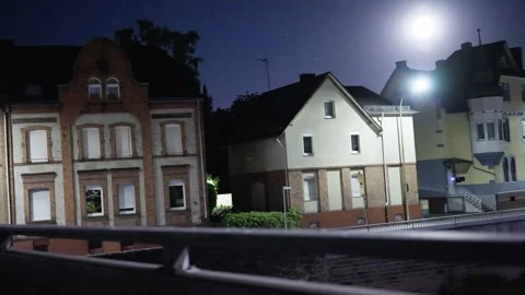 Exploring the captivating urban mood during nighttime with moonlit streets all Video stock 315002752