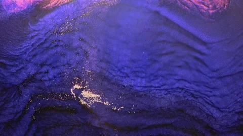 Exploring the captivating waves of vibrant blue and golden textures of a Stock Footage 288246026