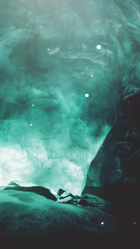 Exploring a cave with distinct green light and rock formations in nature Stock Footage 337970875
