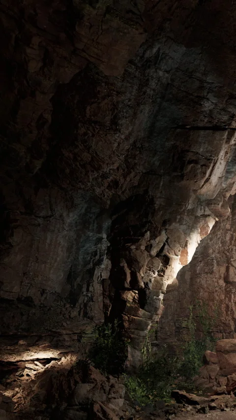 Exploring a cave with natural rock formations and soft light at night Stock Footage 341251365