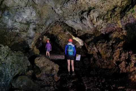 Exploring cave Fotos Stock
