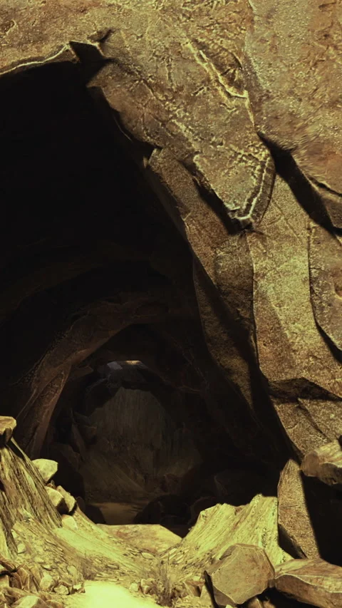 Exploring a cave with rocky walls and a dark passageway in the background Stock Footage 334171286