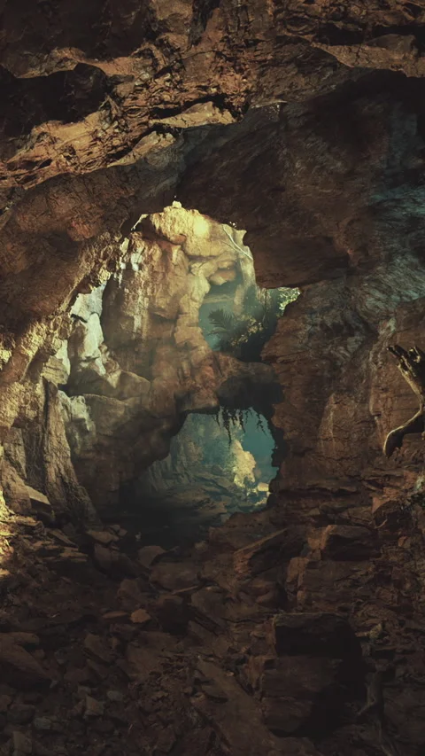 Exploring a cave system with rocks and a distant light in the background Stock Footage 331444240