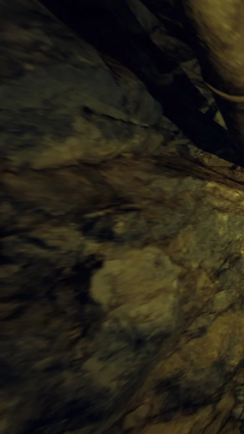 Exploring cave walls and rock formations during a geological tour Stock Footage 339950358