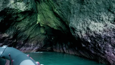 Exploring caves by boat Stock Footage 168563498