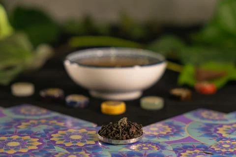 Exploring chakra balance through herbal tea and mystical symbols Stock Photos
