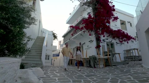 Exploring charming streets adorned with bougainvillea in Paros, Greece Stock Footage 336528918