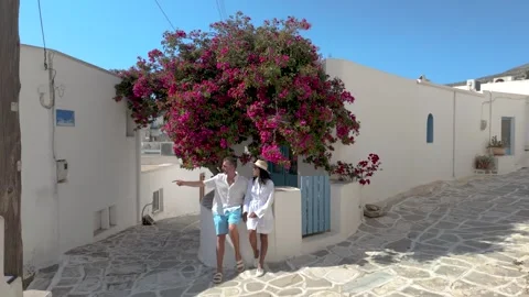 Exploring charming streets and vibrant flowers in Paros, Greece Stock Footage 336530403