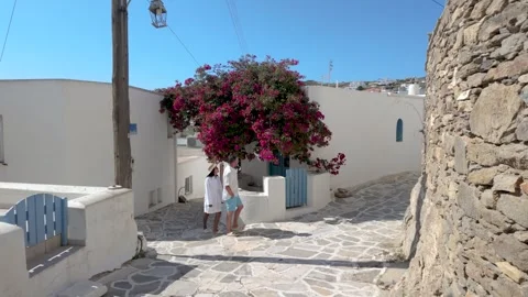 Exploring the charming streets of paros, greece under bright blue skies Stock Footage 336530602