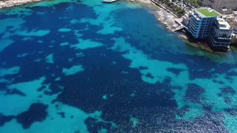 Exploring Clear Blue Waters and Coral Formations Near a Coastal Area During Stock-Footage 333918465
