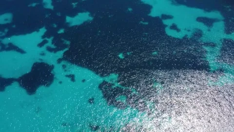 Exploring the Clear Water and Coral Formations of a Tropical Ocean at Midday Stock Footage 333918440