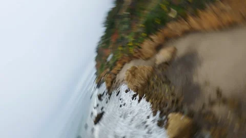 Exploring coastal cliffs and rocky beaches with FPV drone flight Stock Footage 337001690