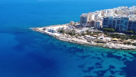 Exploring Coastal Views in Malta With Clear Blue Waters and Shoreline Stock Footage 333918866