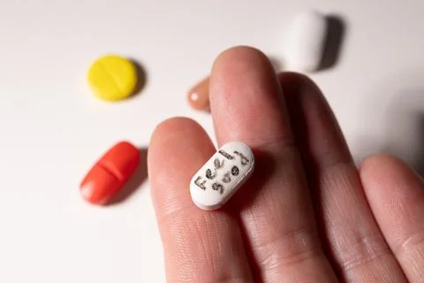Exploring the Complex Relationship Between Pills and Mental Health in Modern Stock Photos
