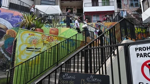 Exploring Comuna 13: Vibrant Murals and Life on the Iconic Escalators Stock Footage 168325164