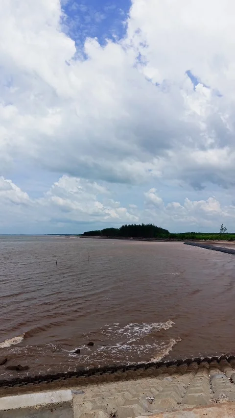 Exploring Con Nhan Beach in Vinh Long Vietnam on a cloudy day Stock Footage 346620773