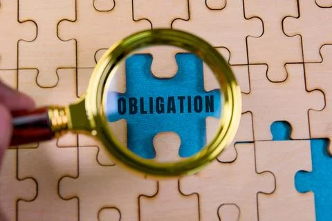 Exploring the concept of obligation through a puzzle piece Stockfoto's