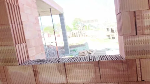 Exploring the construction process in a brick building site. Stock Footage 334653337