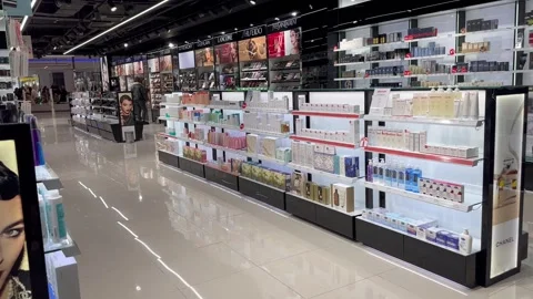 Exploring the cosmetics section in a contemporary, well-lit shop Stock Footage 281595999