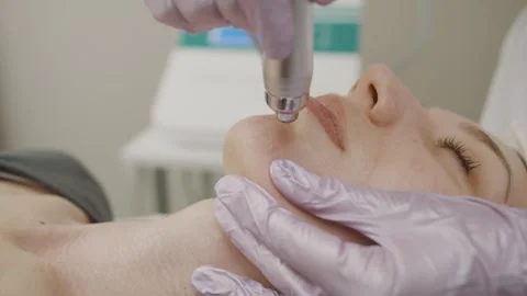 Exploring cosmetology techniques with permanent makeup application on a girl Video stock 314257018
