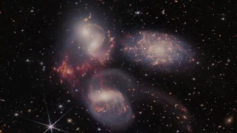 Exploring Cosmic Dance of Tri-Galaxy Cluster in Deep Space Stock Footage 303051796