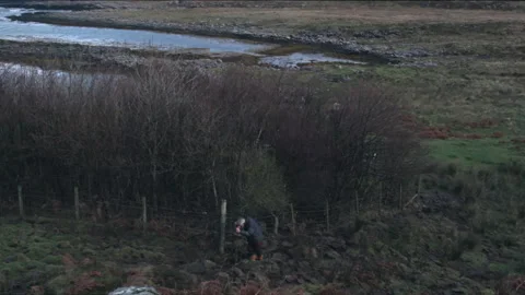 Exploring the countryside while walking along a river at sunset Stock Footage 325814297