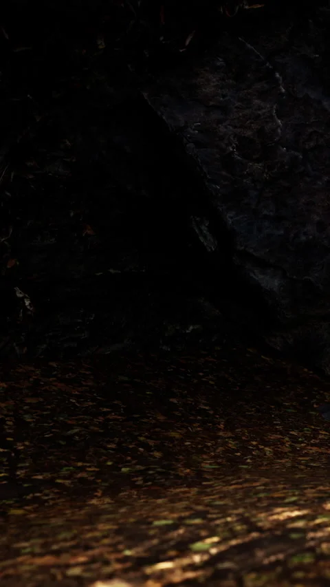 Exploring a dark cave with rocks and earth beneath in an outdoor setting Stock Footage 337995424